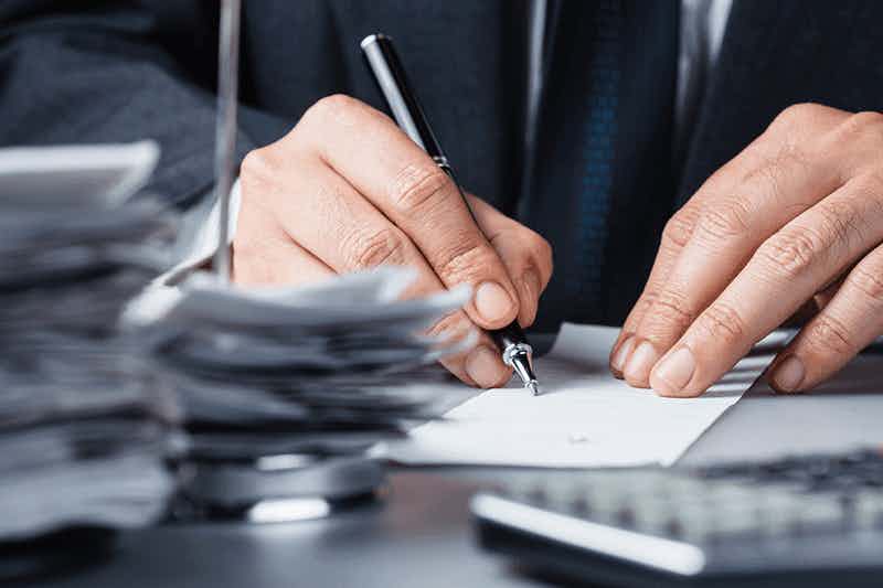 Man signing a paper